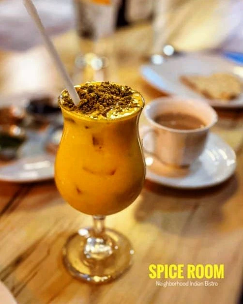 Mango Lassi – Refreshing yogurt-based drink blended with fresh mango puree, a touch of honey,  | SPICE ROOM Denver