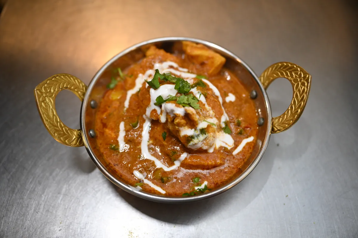 Chicken Madras – A South Indian classic — spicy, tangy chicken curry finished with a cream swirl | SPICE ROOM Denver