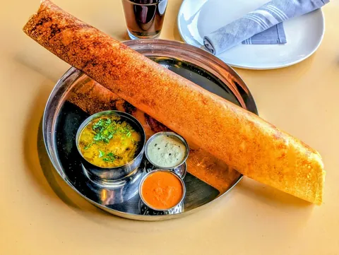 Golden lace-edged South Indian dosa at SPICE ROOM
