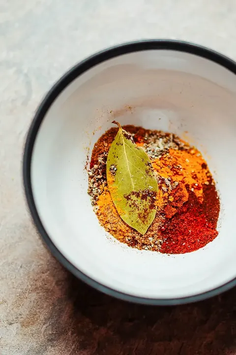 Whole Indian spices tempered in hot oil at SPICE ROOM