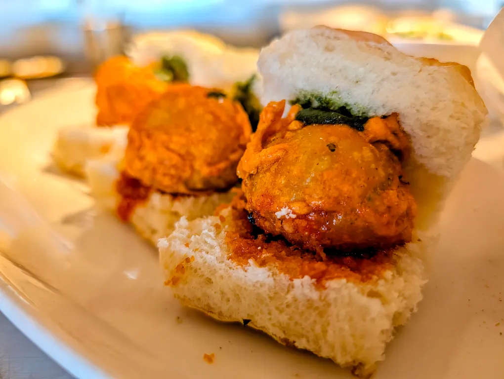 Vada Pav – Mumbai's beloved street slider — spiced potato fritter in a soft bun with green chili | SPICE ROOM Denver