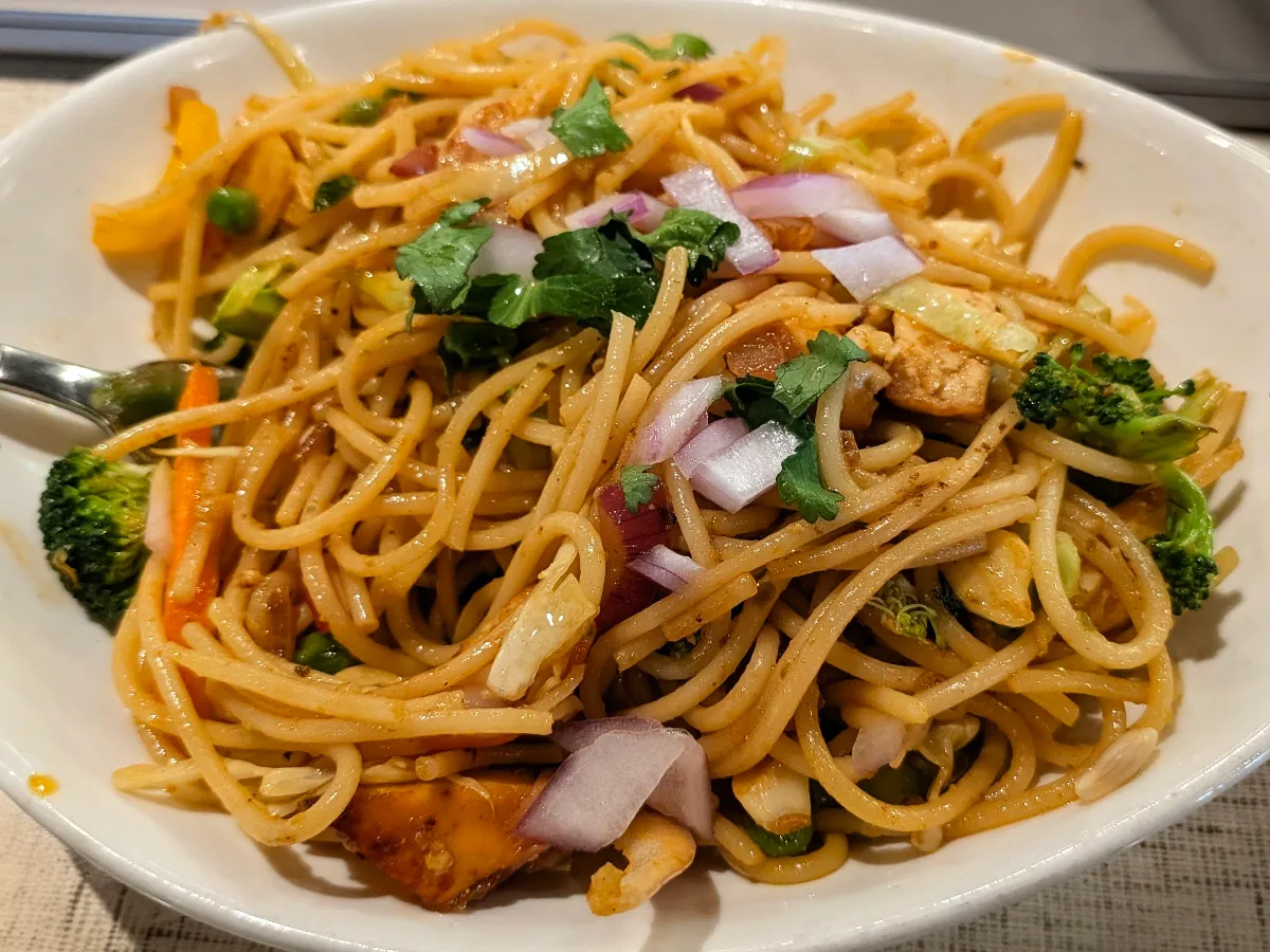 Vegetable Noodles – Stir-fried egg noodles loaded with fresh vegetables in a savory Indo-Chinese sau | SPICE ROOM Denver