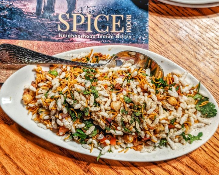 Bombay Bhel — Puffed rice tossed with crisp sev, tangy tamarind, and fresh