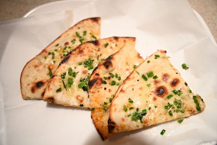 Cheese Naan – Molten cheese rivers hidden inside pillowy naan – stretchy, gooey, and irresisti | SPICE ROOM Denver