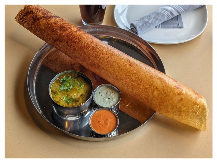 Kal Dosa – A soft, thick Tamil-style dosa — fluffy and pillowy rather than paper-crisp. Per | SPICE ROOM Denver