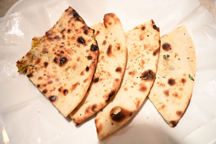 Potato Naan – Soft naan stuffed with seasoned mashed potato, baked in our clay tandoor. A hear | SPICE ROOM Denver